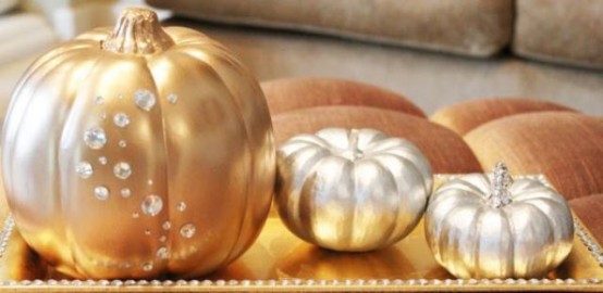 gold and silver pumpkins decorated with crystals are bright and romantic Halloween decorations or centerpieces