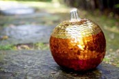 an ombre red, copper and silver sequin pumpkin is a shiny and glam piece for a Halloween party in glam style