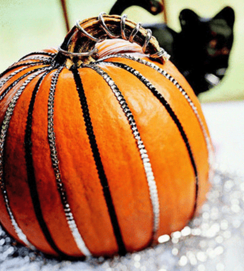 glam up your pumpkin with black and silver sequin straps is a very chic and easy decoration you can easily make