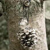 a mercury glass pinecone and an acorn can be used as fall or winter decorations for your home