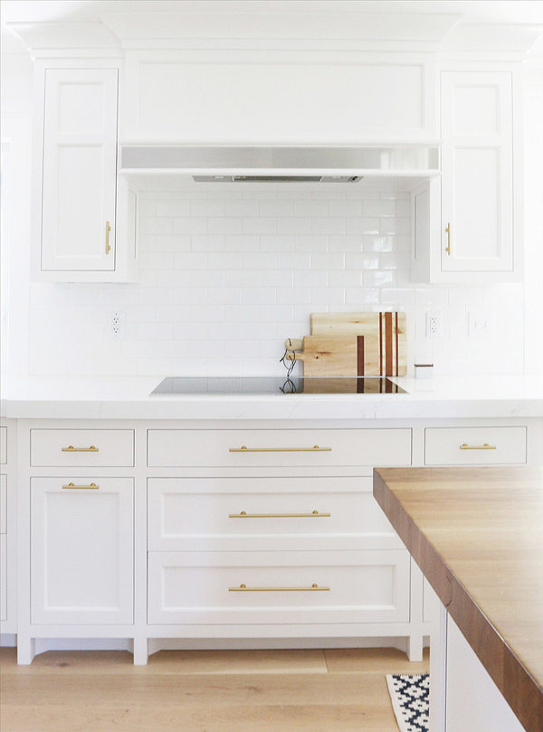 Chic White Kitchen Remodel With Brass Touches