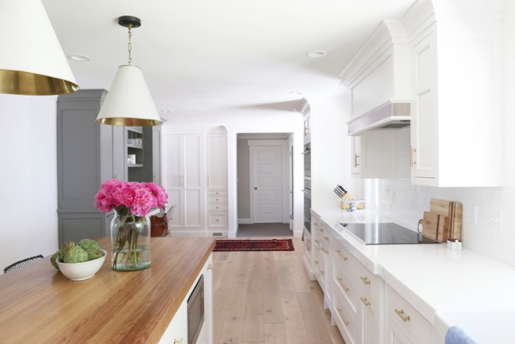 Chic White Kitchen Remodel With Brass Touches