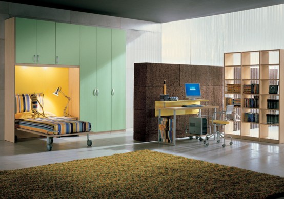 a teen room with a large green storage unit with a built-in bed and lights, with a tiered desk, a chair and a storage unit, a large rug for more coziness