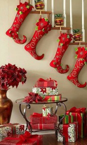 whimsical red and green elf stockings are a fun and bright decoration for Christmas to add a bit of cheerful touch to it