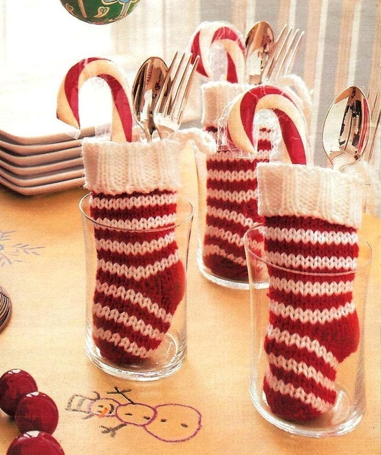 knit red and white stockings as cutlery pockets and with candy canes inside are amazing for setting your Christmas table