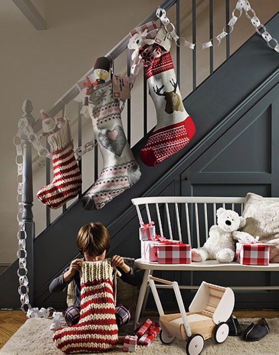 hang some bright and fun sotckings on the railing and put some small gifts inside to make your kids and family on the whole excited