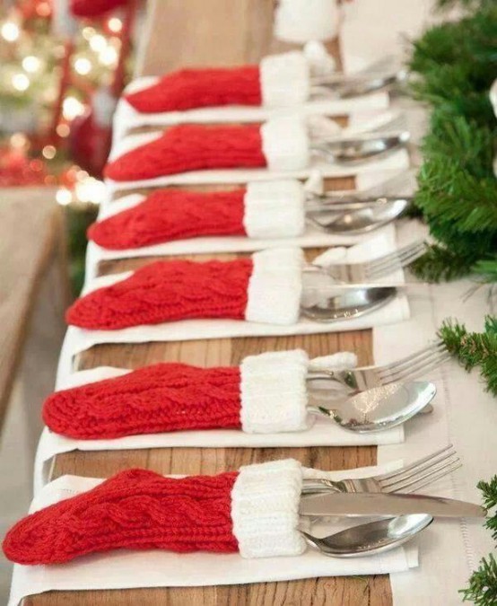 little knit red and white stockings as cutlery pockets are very whimsy, fun and cool and will make your Christmas tablescape amazing