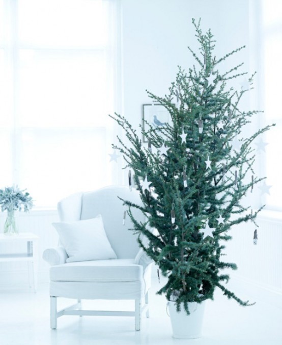 a modern Christmas tree with clay star ornaments is a fresh idea for a modern or Scandinavian space