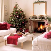 a bright Christmas tree with traditional decor – red and white ornaments of various kinds, lights and garlands is super cool