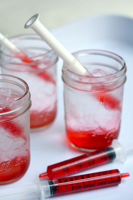 jars with bloody syringes for decorating your Halloween party - make them yourself