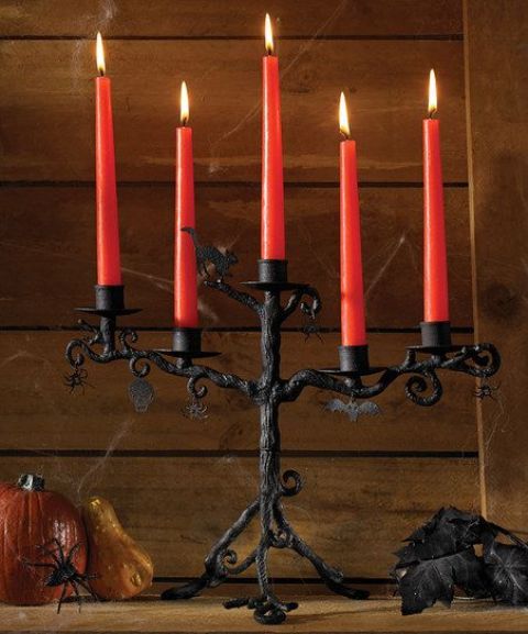 a refined black candelabra with red candles is a nice Halloween decoration to rock