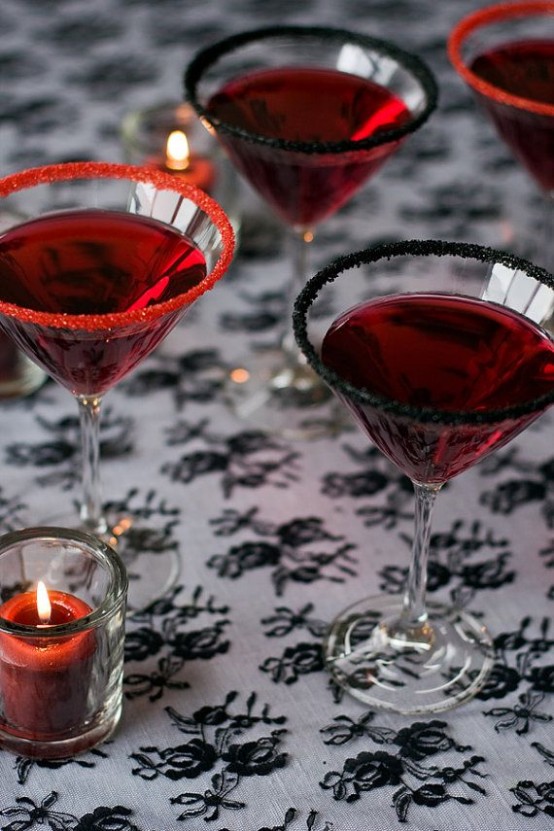 red cocktails with red and black sugar on the edges are perfect for rocking them at your Halloween party