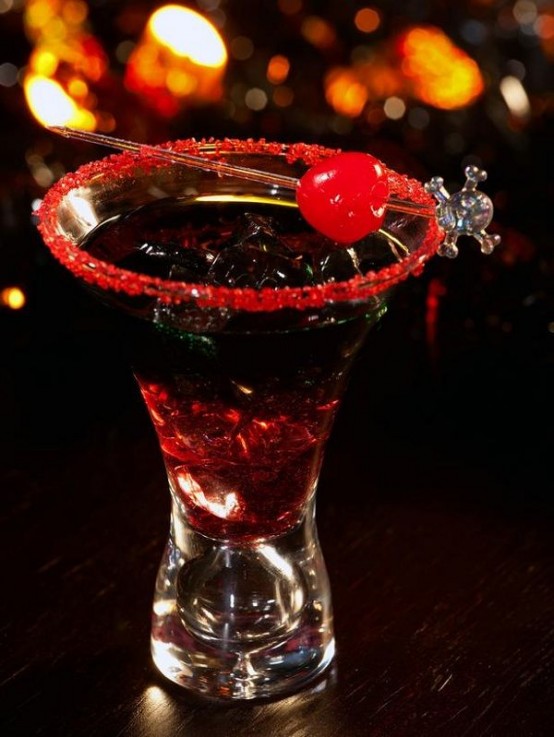 an ombre black to red cocktail with a red sugar rim and a red cherry on top is delicious for a Halloween party