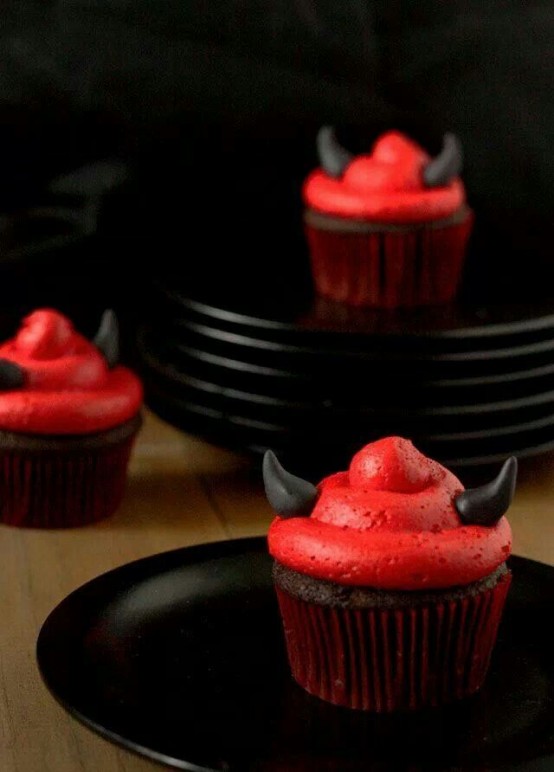 black cupcakes with red frosting and black horns are great for a Halloween party and will make everyone happy
