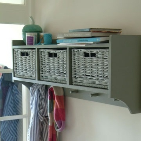 Multifunctional storage is always a great choice. A small unit could provide hidden storage space, coat hooks and an open shelf.