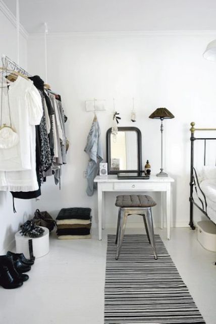 a makeshift closet is a very cool idea for a bedroom, you may show off your clothes and shoes making them part of decor and it doesn't look bulky