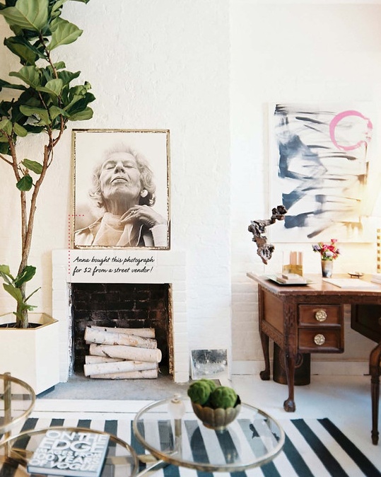 fresh spring touches with greenery, moss, bright artworks is a cool idea for a living room