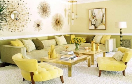 a bright spring living room with a neutral sofa, yellow chairs, green and yellow pillows and sunburst mirrors and artworks