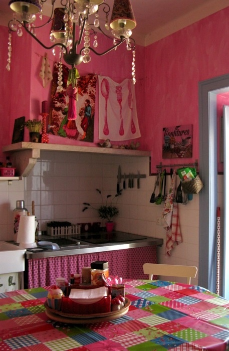 hot pink walls, textiles and a crystal chandelier for a boho meets vintage kitchen