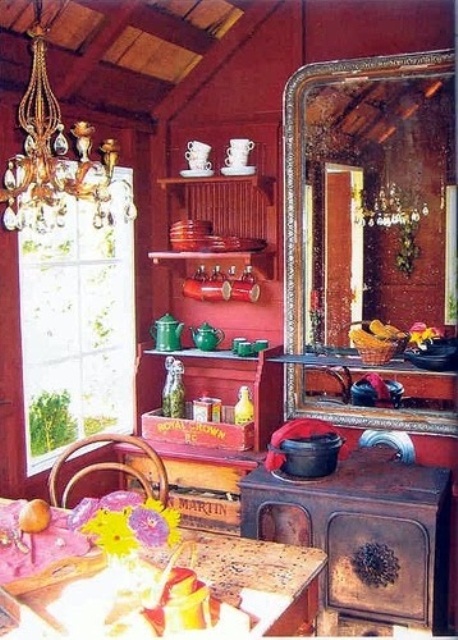 a boho meets vintage kitchen done in red, pink and yellow