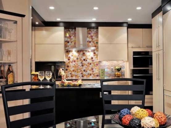 a black and tan kitchen with black countertops and a bright tile backsplash, built-in lights and black chairs is a chic idea