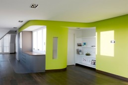 Colorful Loft Design With Wall Integrated Service Spaces