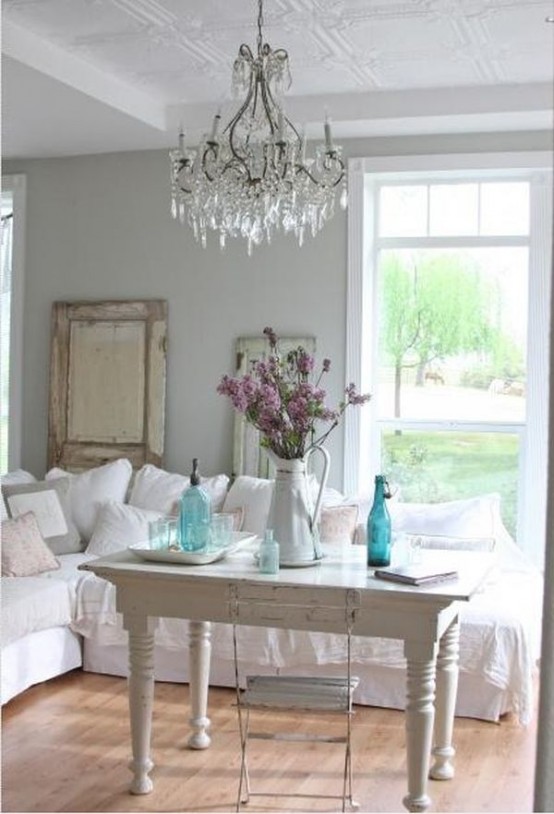 Comfy Farmhouse Living Room Designs To Steal This large sofa is just as comfy as is swanky. A vintage table provides a perfect place to display a beautiful jug centerpiece.