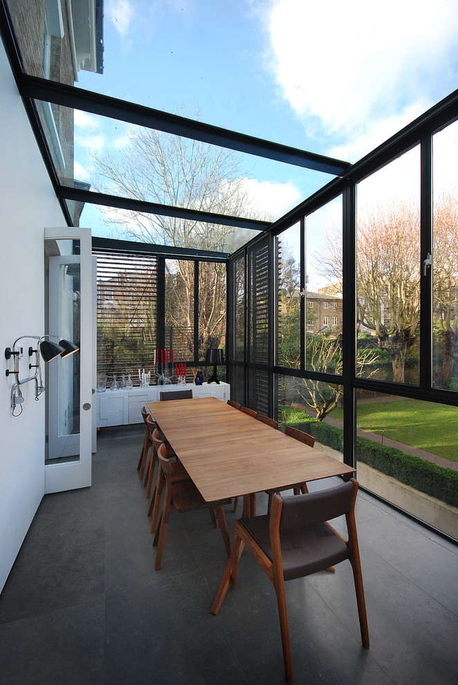 contemporary narrow sunroom extension that features black shutters