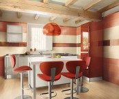 a bright and cool red and white kitchen with tiled walls and neutral cabients and a white kitchen island is wow