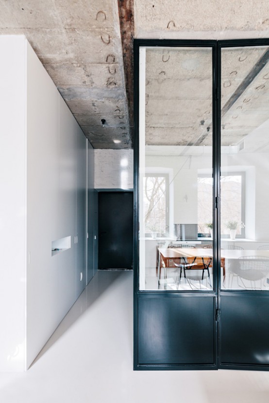 Contrasting Minimalist Apartment With A Black Steel Window Wall