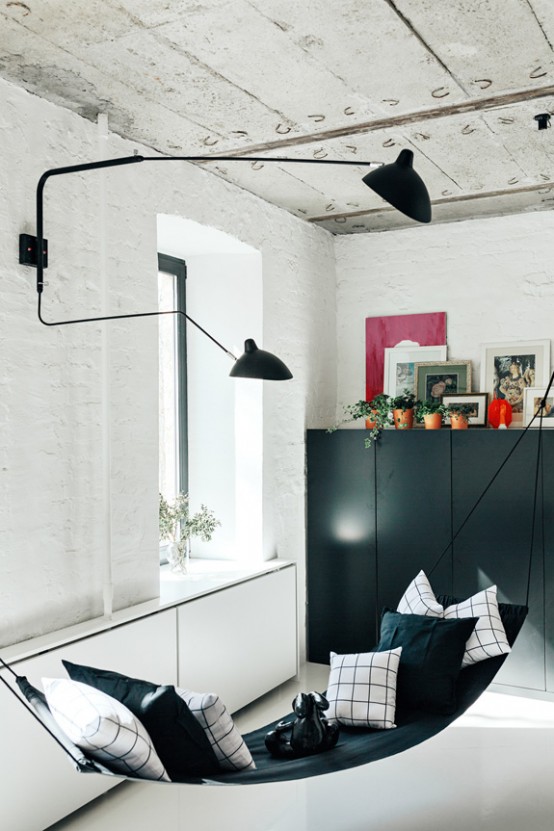 Contrasting Minimalist Apartment With A Black Steel Window Wall
