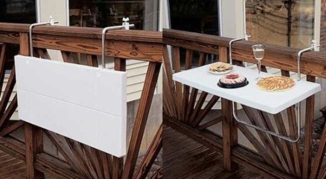 a white folding mini table that can be attached to the railing can be used for anything   from working to holding planters