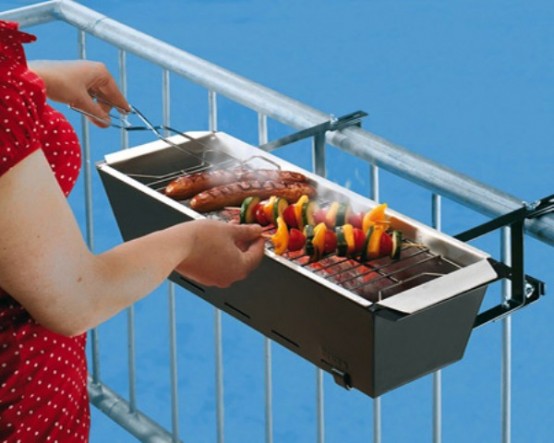 a small metal grill can be attached to the railing and can be used anytime you want - it's a very smart and cool idea for a tiny balcony
