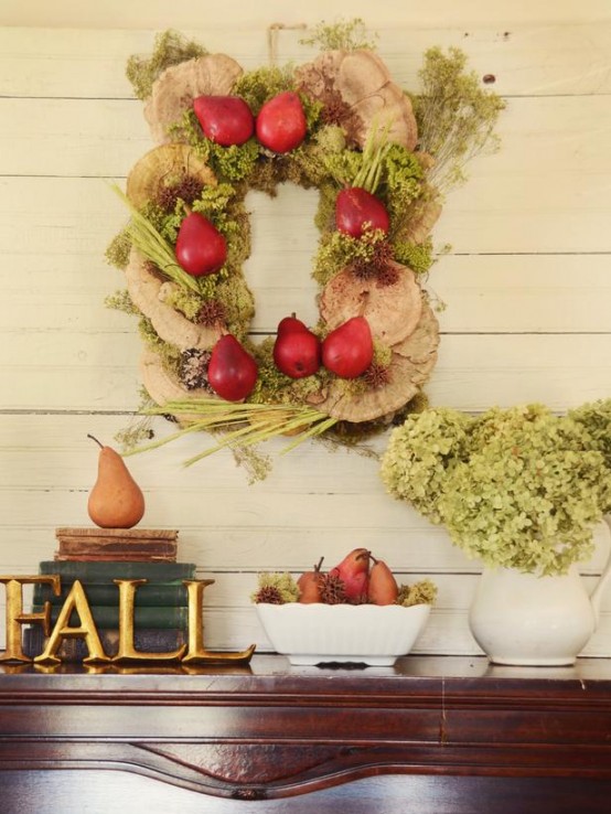 a true harvest wreath of wood slices, veggies, fruits and herbs is a fun and creative idea for Thanksigiving