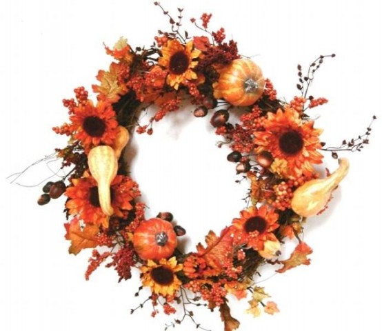 a bright fall or Thanksgiving wreath of faux blooms, gourds and berries is a pretty idea that you can easily DIY