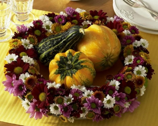 a bold Thanksgiving wreath of purple and white blooms and gourds and pumpkins in the center can double as a centerpiece for a party