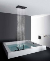 a contemporary to minimalist bathroom in grey, black and white, with a square bathtub and a rain shower is a lovely and cool idea