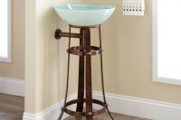 a darkened metal leg vanity for holding a blue glass bowl sink is a very bold and unusual idea for an eclectic bathroom