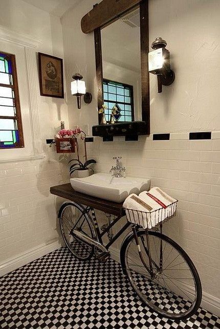 a unique sink stand solution - a bike with a basket for towels is a super creative idea, a cool way to repurpose your old bike that you don't need anymore