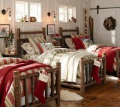 bright Christmassy blankets and bedding, mini Christmas trees with red ornaments, some wreaths to turn on a holiday feel in the kids’ room
