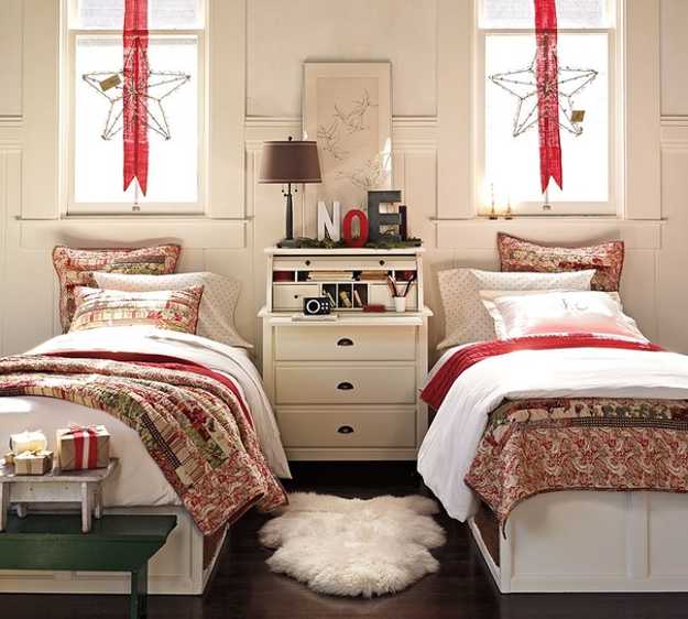 red ribbons with stars hanging on the windows and bright printed holiday bedding for Christmas decor