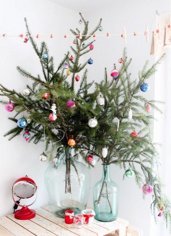bottles with fir branches and colorful ornaments will bring a festive feel to any room, you don't need a whole tree