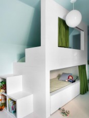 a small kids’ room with aqua walls, with a built-in bunk bed and neutral bedding, with curtains for privacy and lots of toys and other stuff