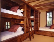 a cozy and welcoming rustic kids’ room with built-in bunk beds and an additional one, with ladders can accommodate up to 5 children