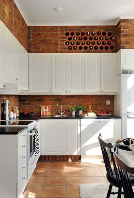 a wine bottle storage built right into a brick wall will save your space and you won't have to buy a separate unit