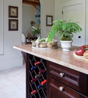 a wine storage unit built into a usual kitchen cabinet is a simple and cool idea if you don’t have many bottles