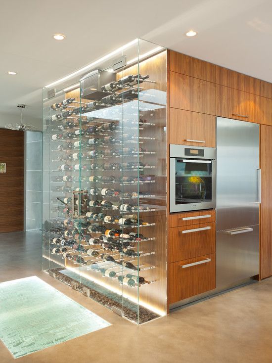 a large clear glass wine cooler as part of the kitchen - put your wine on display and enjoy
