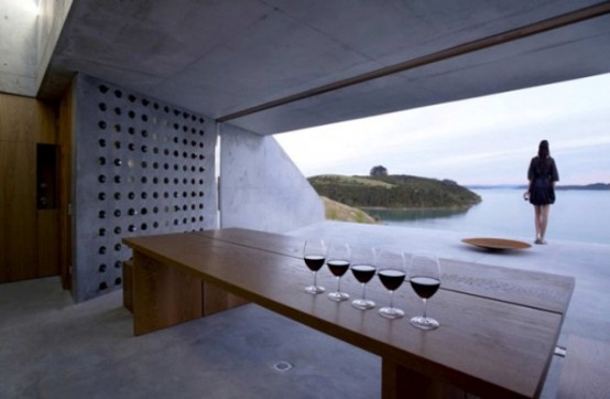a whole concrete wall with holes is a stylish minimalsit wine storage that will also fit an industrial space
