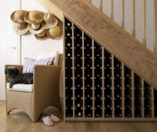 under the stairs wine bottle storage is a creative idea that doesn’t take any floor space