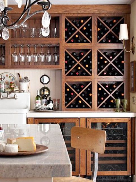 a large wine storage unit that totally matches the kitchen cabinets is a vintage and refined idea